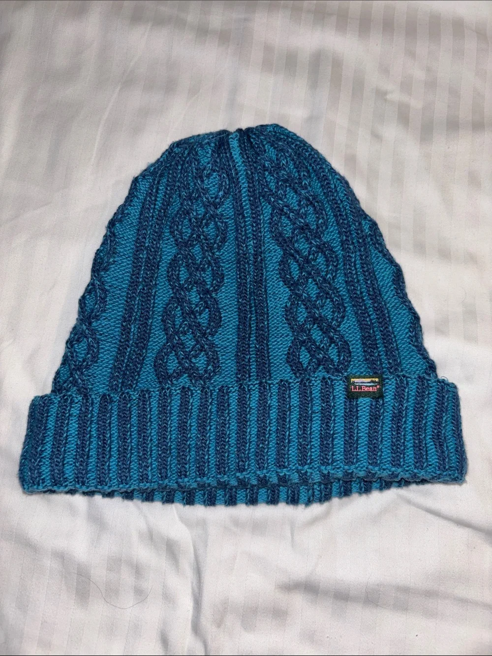 L.L. Bean Women’s Cable Knit Beanie in Teal and Navy